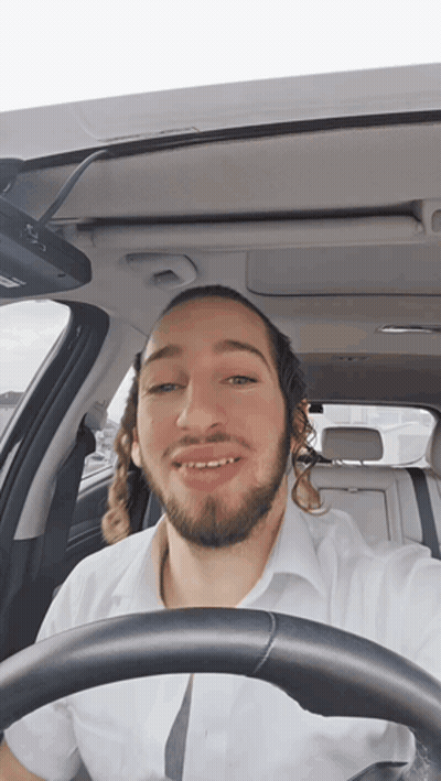 Man With Long Hair And Beard Driving Car GIF