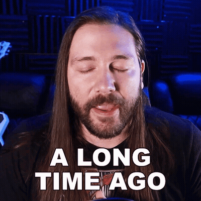 Man With Long Hair And Beard Eyes Closed Saying A Long Time Ago GIF