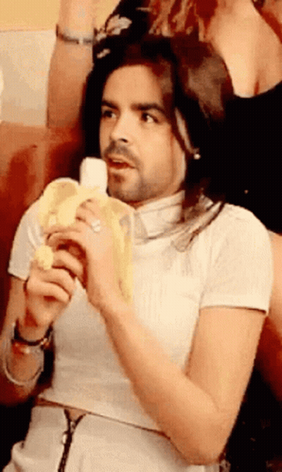 Man With Long Hair And Beard Holding Banana GIF