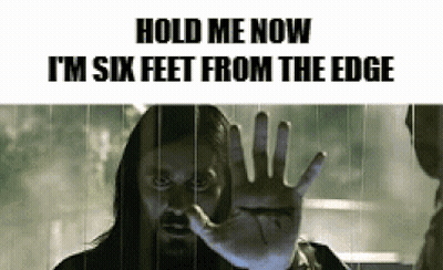 Man With Long Hair And Beard Holding Hand Up GIF