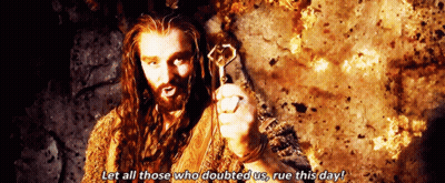 Man With Long Hair And Beard Holding Key Saying Let All Those Who Doubted Us Rue This Day GIF
