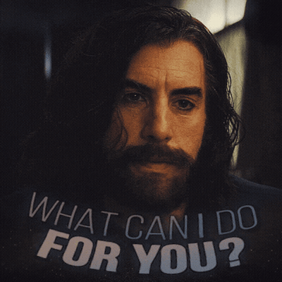 Man With Long Hair And Beard Holding Sign What Can I Do For You GIF