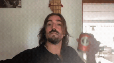 Man With Long Hair And Beard Holding Soda Can With Circle GIF