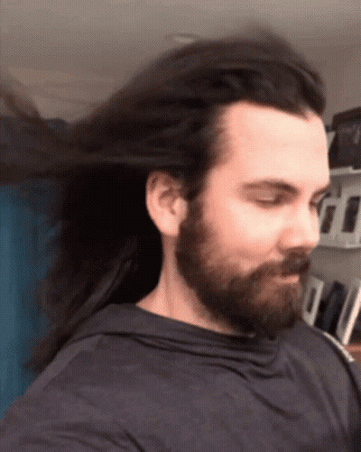 Man With Long Hair And Beard In Black Shirt GIF