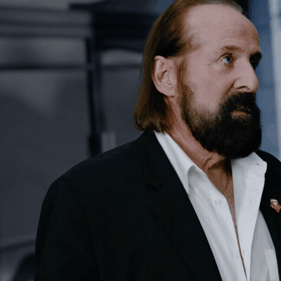 Man With Long Hair And Beard In Black Suit GIF