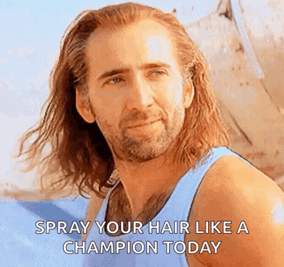 Man With Long Hair And Beard In Blue Tank Top Says Spray Your Hair Like A Champion GIF
