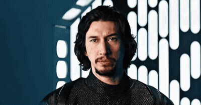 Man With Long Hair And Beard In Front Of Building GIF