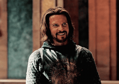 Man With Long Hair And Beard In Green Shirt GIF