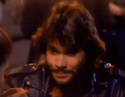 Man With Long Hair And Beard In Leather Jacket GIF