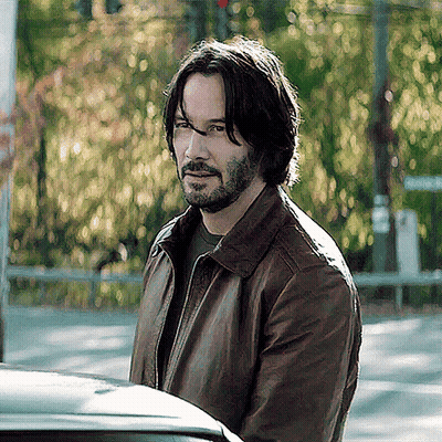 Man With Long Hair And Beard In Leather Jacket GIF