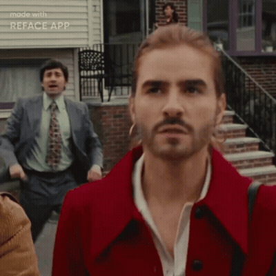 Man With Long Hair And Beard In Red Coat And Tie GIF