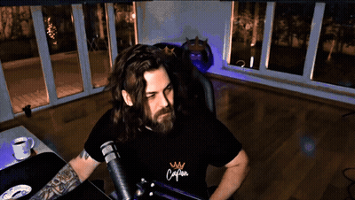 Man With Long Hair And Beard In Shirt Saying Calm GIF