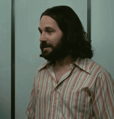 Man With Long Hair And Beard In Striped Shirt GIF