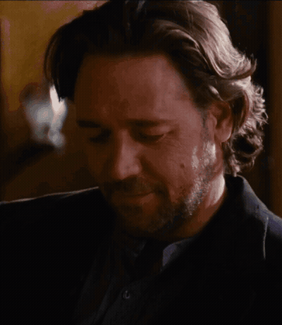 Man With Long Hair And Beard Looking Down GIF