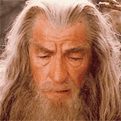 Man With Long Hair And Beard Looking Down GIF