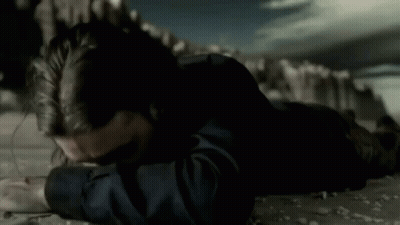 Man With Long Hair And Beard Lying Down GIF