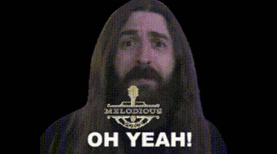 Man With Long Hair And Beard Making Devil Horns Saying Oh Yeah GIF