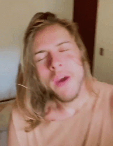 Man With Long Hair And Beard Making Funny Face GIF