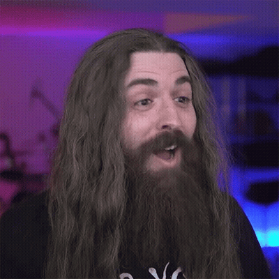 Man With Long Hair And Beard Making Funny Face GIF