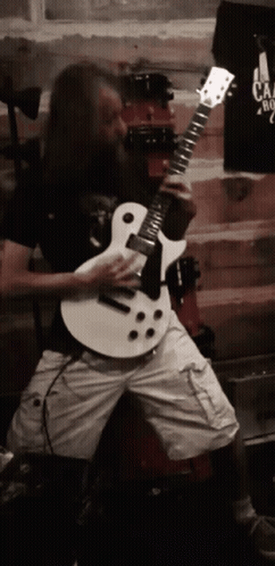 Man With Long Hair And Beard Playing White Guitar GIF