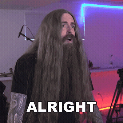 Man With Long Hair and Beard Saying Alright