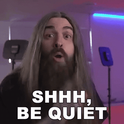 Man With Long Hair And Beard Saying Shhh Be Quiet GIF