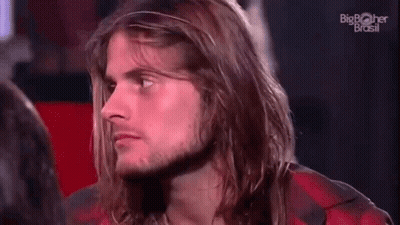 Man With Long Hair And Beard Sitting In Red Chair GIF