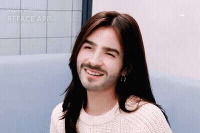 Man With Long Hair And Beard Smiling In White Sweater GIF