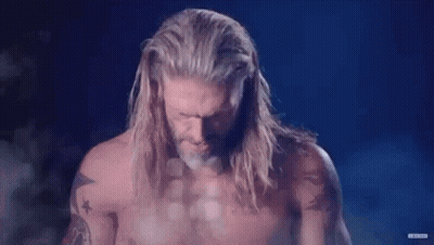 Man With Long Hair And Beard Standing Before DC GIF
