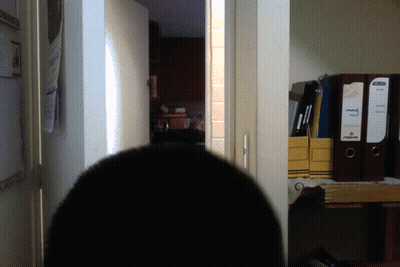 Man With Long Hair And Beard Standing In Dark Room GIF
