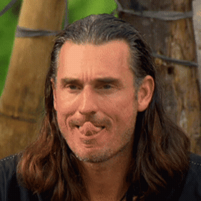 Man With Long Hair And Beard Sticking Out Tongue GIF