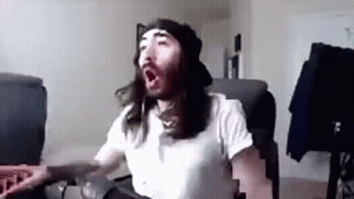 Man With Long Hair And Beard Yawning GIF