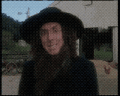 Man With Long Hair And Black Hat Smiling GIF