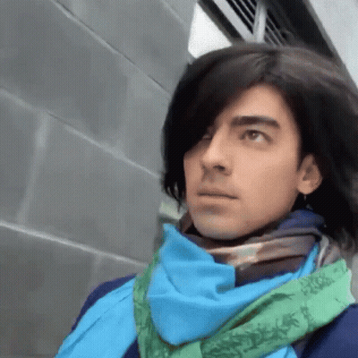 Man With Long Hair And Blue Scarf GIF