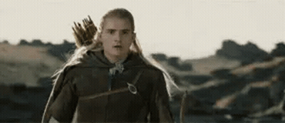 Man With Long Hair And Bow And Arrow In Field GIF