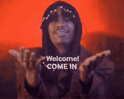Man With Long Hair And Hat Saying Welcome GIF