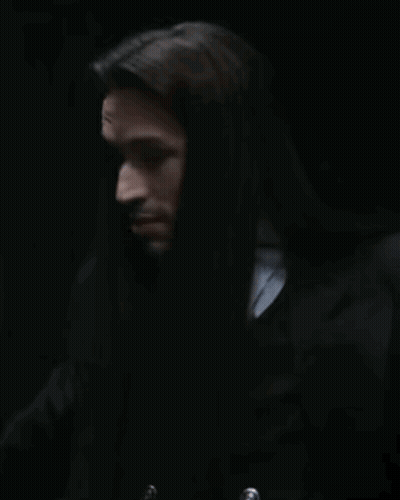 Man With Long Hair And Him In Red GIF