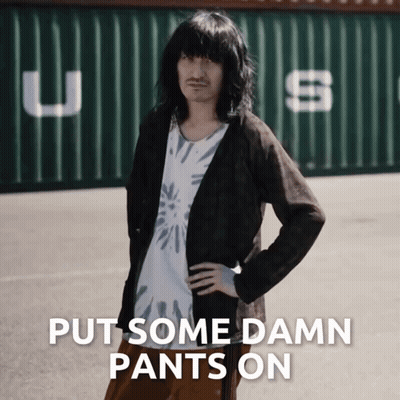 Man With Long Hair And Mustache By Green Container Saying USS GIF