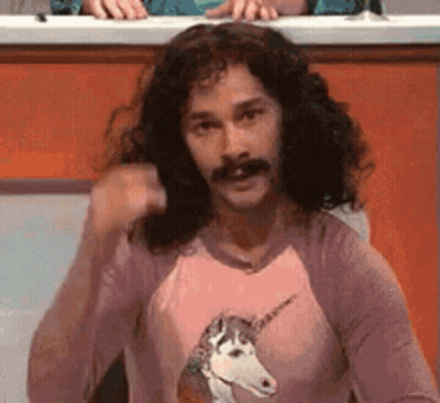 Man With Long Hair And Mustache In Unicorn Shirt GIF