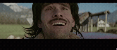 Man With Long Hair And Mustache Smiling GIF