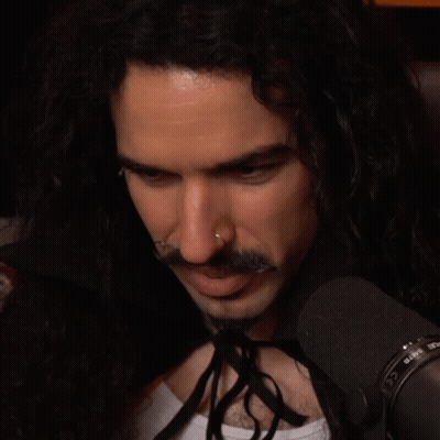 Man With Long Hair And Nose Ring At Microphone Saying Rode GIF