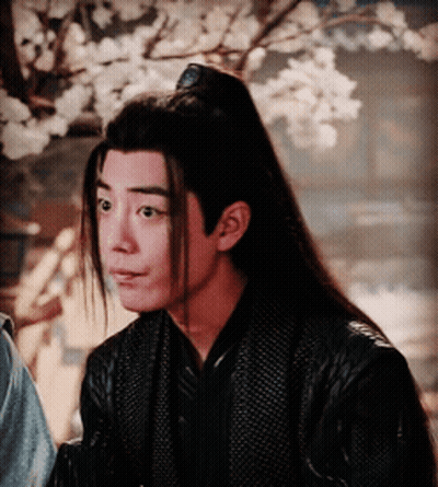 Man With Long Hair And Ponytail In Black Jacket GIF