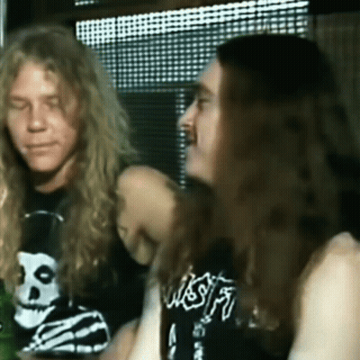 Man With Long Hair And Skull Shirt GIF