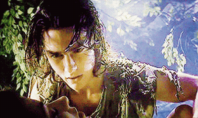 Man With Long Hair And Snake Around Neck Looking At Woman GIF