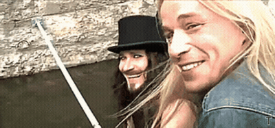 Man With Long Hair, Beard, And Top Hat GIF