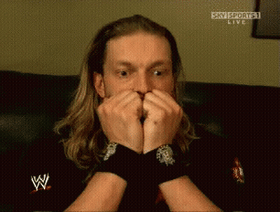 Man With Long Hair Covering Mouth Watching Sky Sports GIF