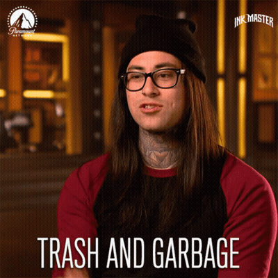 Man With Long Hair Glasses And Hat Saying Trash GIF