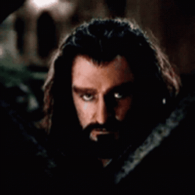 Man With Long Hair Hiding Face Behind Snake GIF
