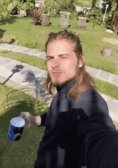 Man With Long Hair Holding Pepsi Cup GIF