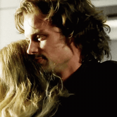 Man With Long Hair Hugging Woman GIF